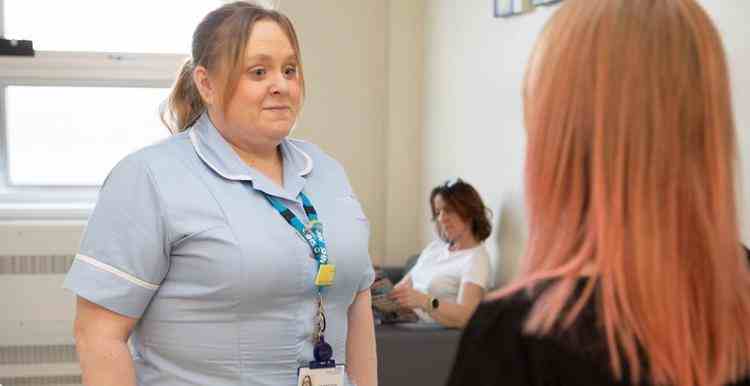 Image of a nurse talking to a patient for the blog posts or news article Women in England want at home cervical screening tests on the NHS