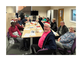 Image of volunteers at Christmas visiting Healthwatch Lancashire