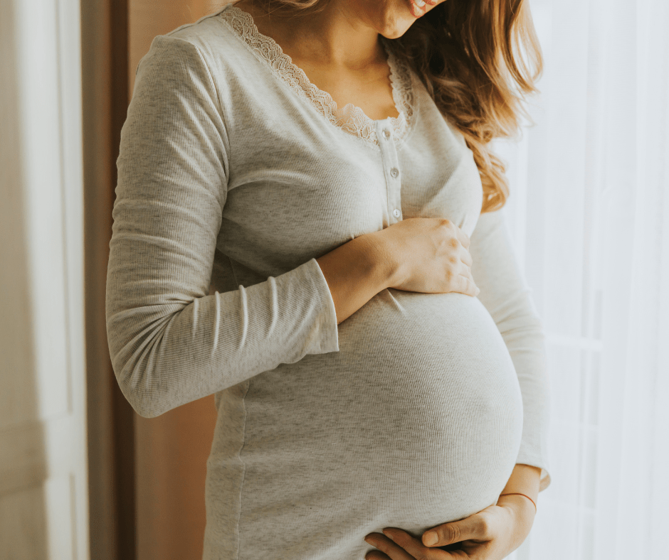 image of a pregnant woman holding her bump, for the PR news article Birth Services to be Reinstated at Helme Chase on the Healthwatch Lancashire website