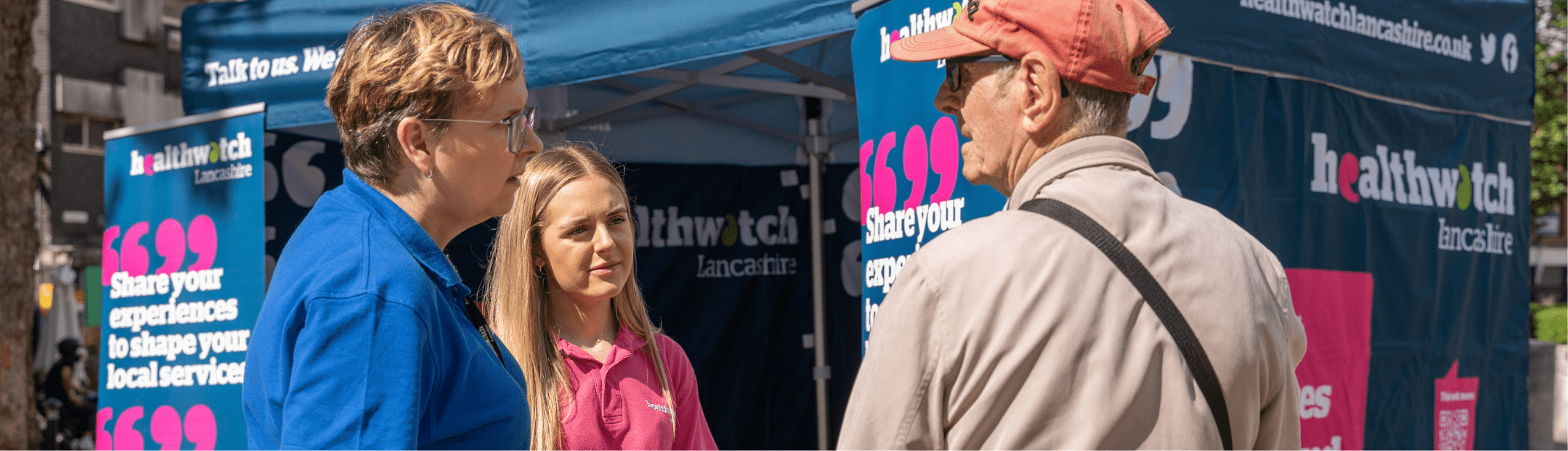 Image of heatlthwatch lancashire team talking with member of the public